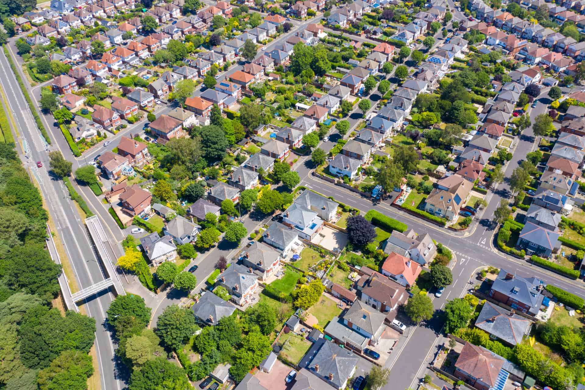 Aerial drone photo of a housing estate Bournemouth showing rows of suburban houses, gardens and streets