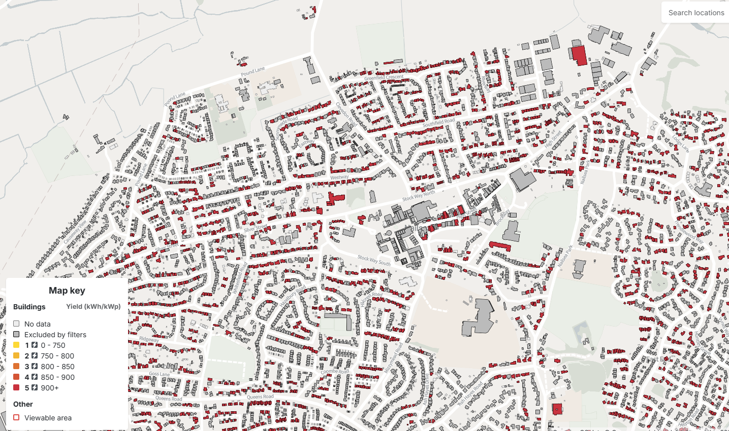An image taken from the Solar Wizard tool which shows an aerial map. The map shows which buildings have high solar potential by highlighting them in red.