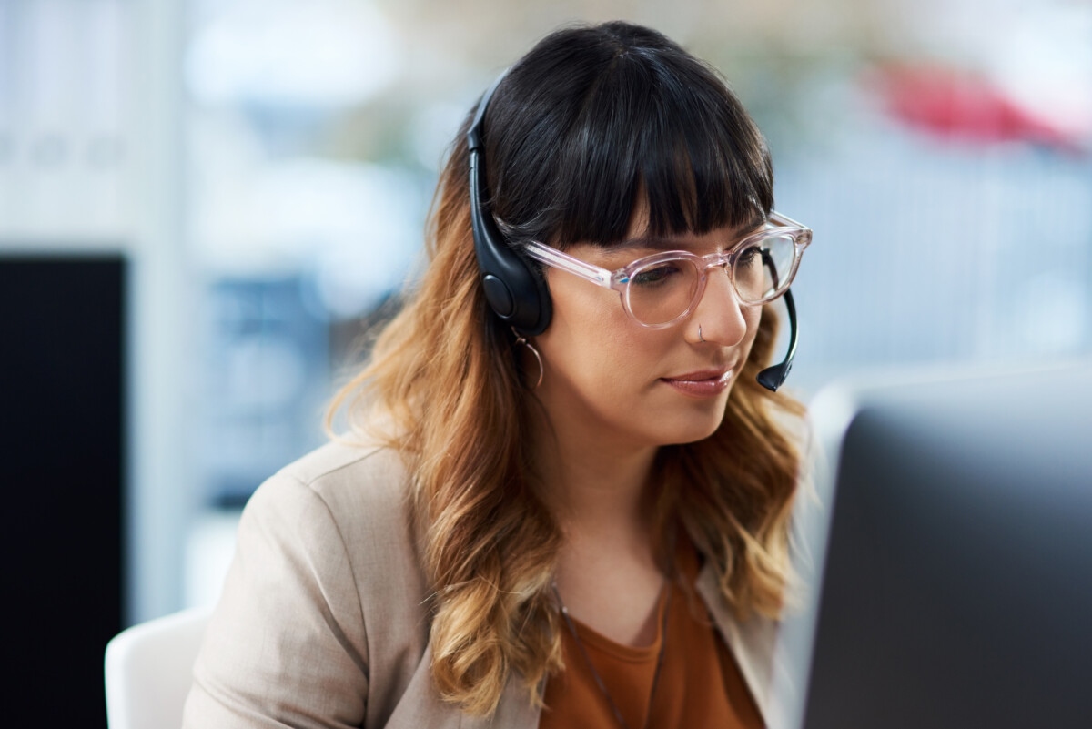 An advisor taking a call on a helpline.