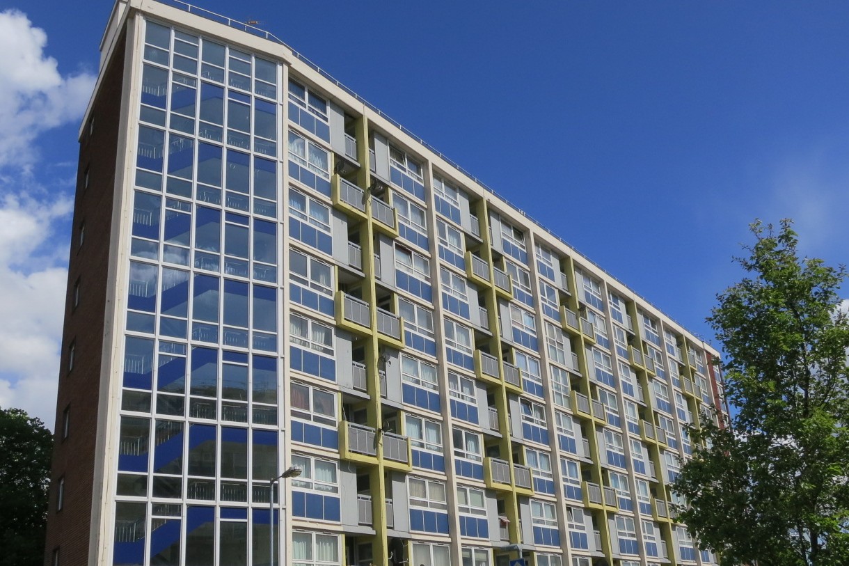 block with blue sky behind it.